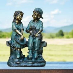 Alpine Corporation 16" Polyresin Girl and Boy with Dog Sitting on Bench Sculpture Bronze