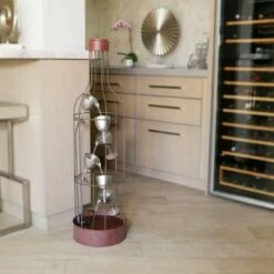 Alpine Corporation 44" Iron Indoor/Outdoor Bottle Shaped Water Fountain with Tiering Wine Glasses Brown