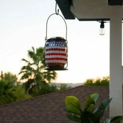 Alpine Corporation Alpine 7" Solar Patriotic Glass/Iron Hanging Lantern with LED Lights Cool White